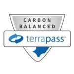 A shield-shaped badge with the words "Carbon Balanced" above the TerraPass logo, featuring blue arrows forming a circle—perfect for any pet lover or mobile dog grooming business committed to sustainability.